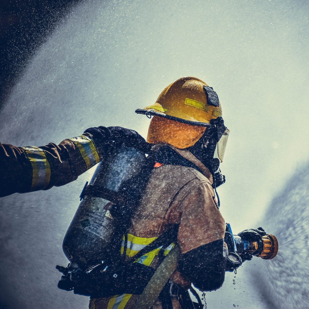 fireman holding fire hose